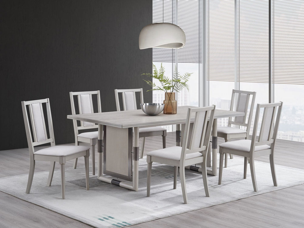Dining table and chairs in a warm neutral room