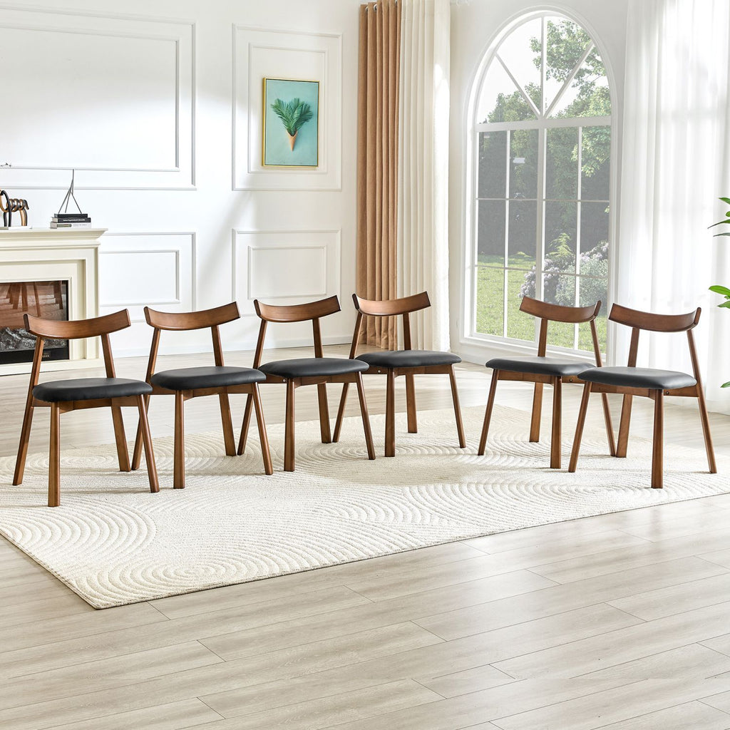 2 walnut colored solid wood dining chairs, with black PU soft cushions and curved backrests that fit the curves of the back, suitable for home dining.