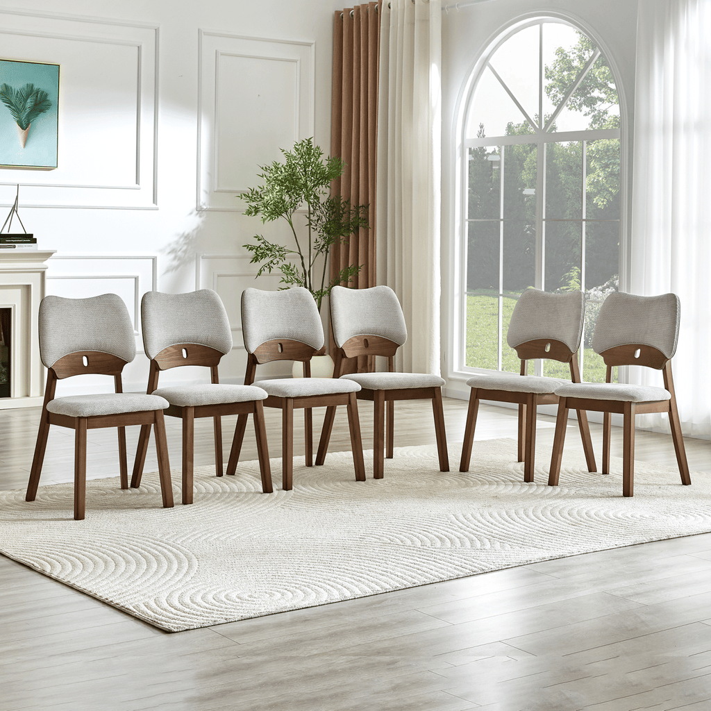 2 walnut colored solid wood dining chairs, with gray soft fabric packaging on the backrest and seat cushion, hollowed out design backrest, for home dining chairs.