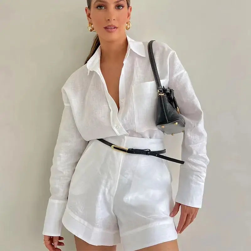 Elevate your style with the Women White and Blue Lapel Button Shirt and High Waist Shorts Set Casual Long Sleeve Blouse Two-Piece Summer Elegant Suit.