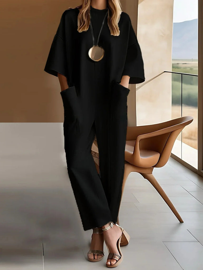 Chic and comfortable, the Women’s Loose Minimalist Jumpsuit with Round Neck Half Sleeves is perfect for any casual office look.
