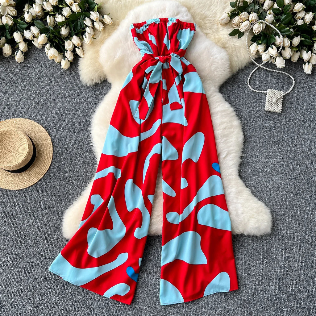 Vibrant Women's Elegant Suspender Jumpsuit Sexy Printed Casual Hip Waist Overalls Romper perfect for stylish spring outings.