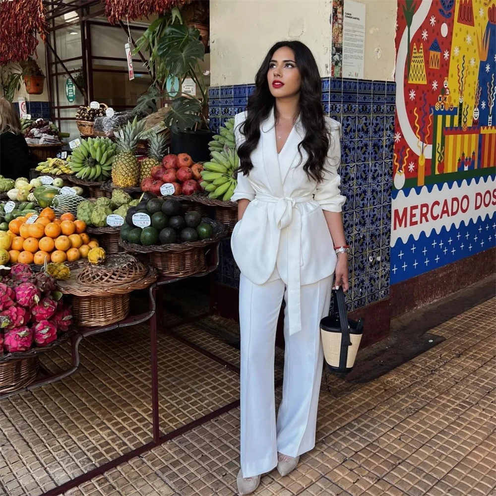 Stylish model wearing the Elegant Women's Slim Fit Suit Set with Belt and Straight Leg Pants for Stylish Commuting.