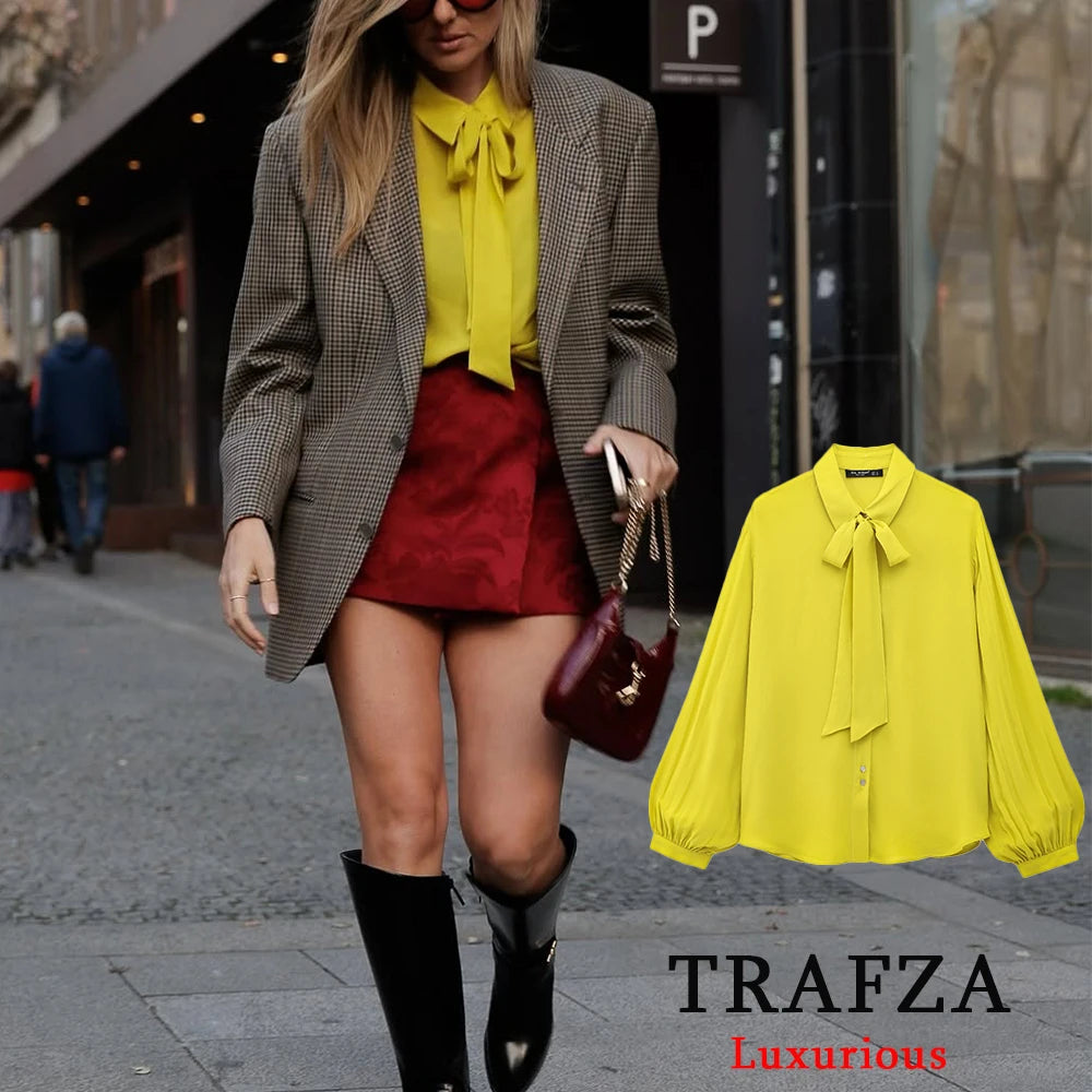 Stylishly flaunt the Yellow Chiffon Loose Fit Long Sleeve Shirt for Women with Bow Tie and Button Detail by TRAFZA.