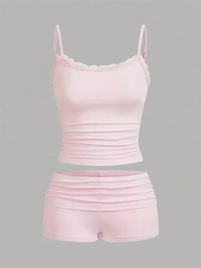 Women's Sleeveless Elastic Crop Top and High Waist Mini Shorts Set Sexy Y2K Sporty Two-Piece Outfit in soft pink hues.