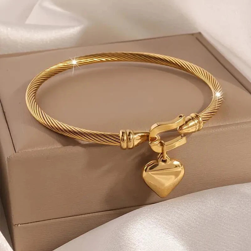 Elegant 18k Gold Color Stainless Steel Heart Pendant Charm Bangle Bracelet for Men and Women, perfect for any occasion.
