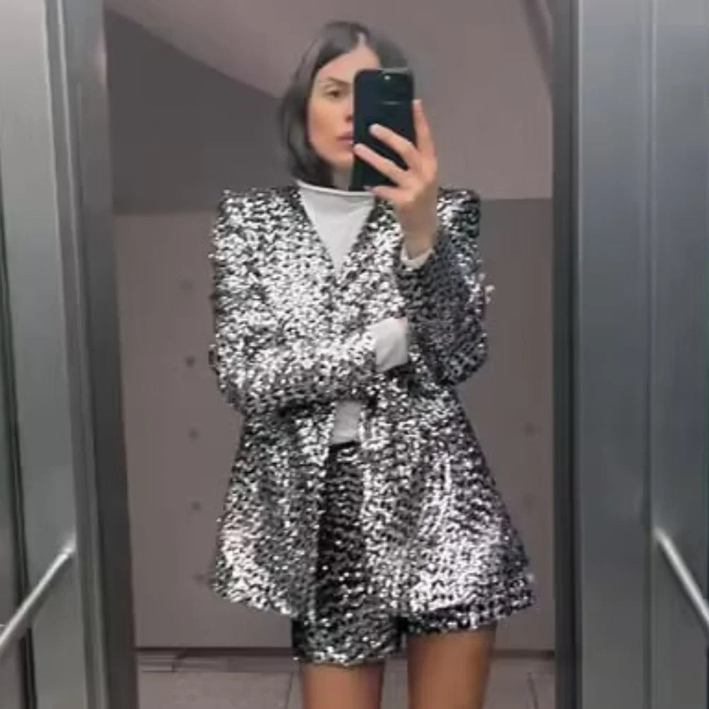 Stylish model wearing Women's Casual Versatile Bead-Embellished Suit Coat and High Waist Shorts Set for elegant spring style.