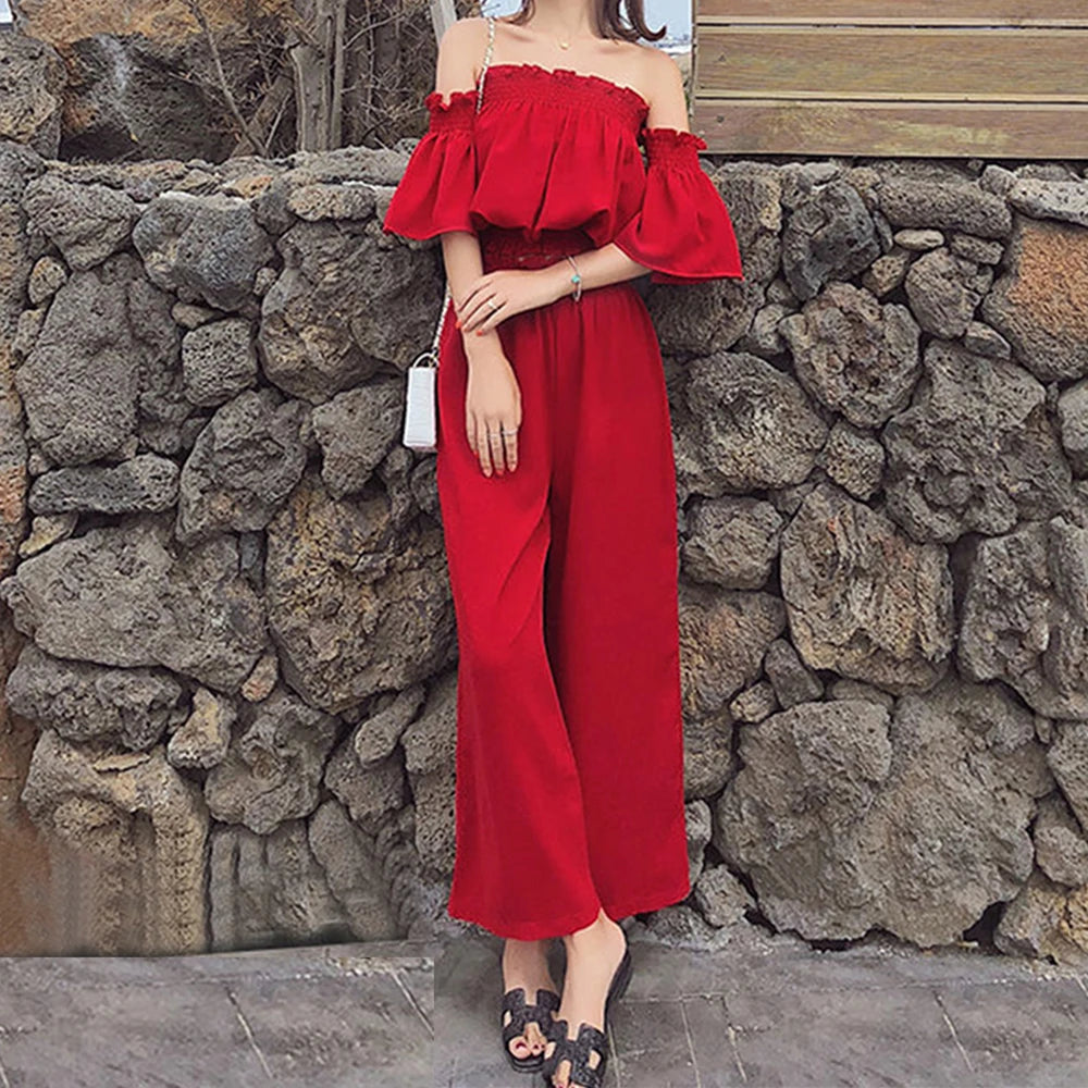 Stylish model showcases the Versatile One Shoulder Exposed Navel Short Top and Flower Bud Elastic Waist Wide Leg Pants Set.