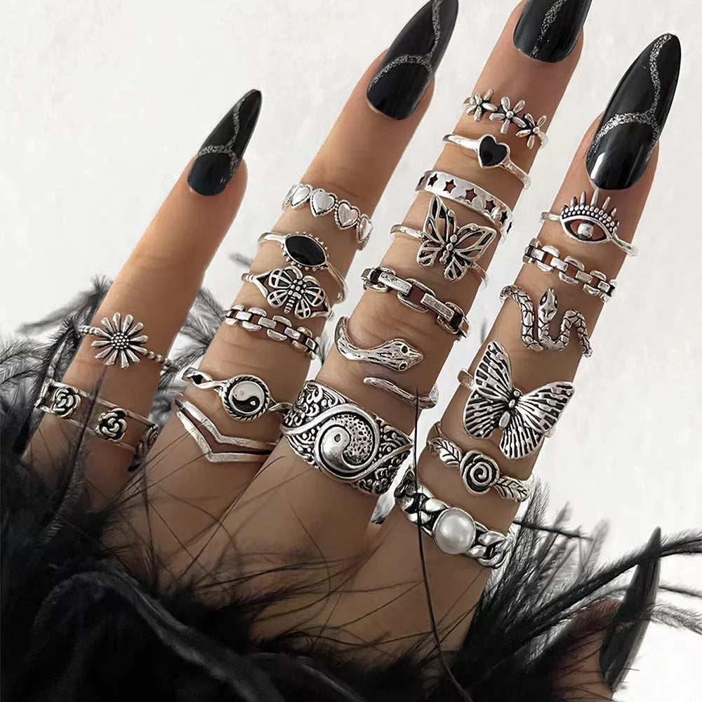 Trendy 21 Pcs Gothic Rings Set for Women featuring snake, butterfly, and evil eye designs, perfect for unique jewelry gifts.