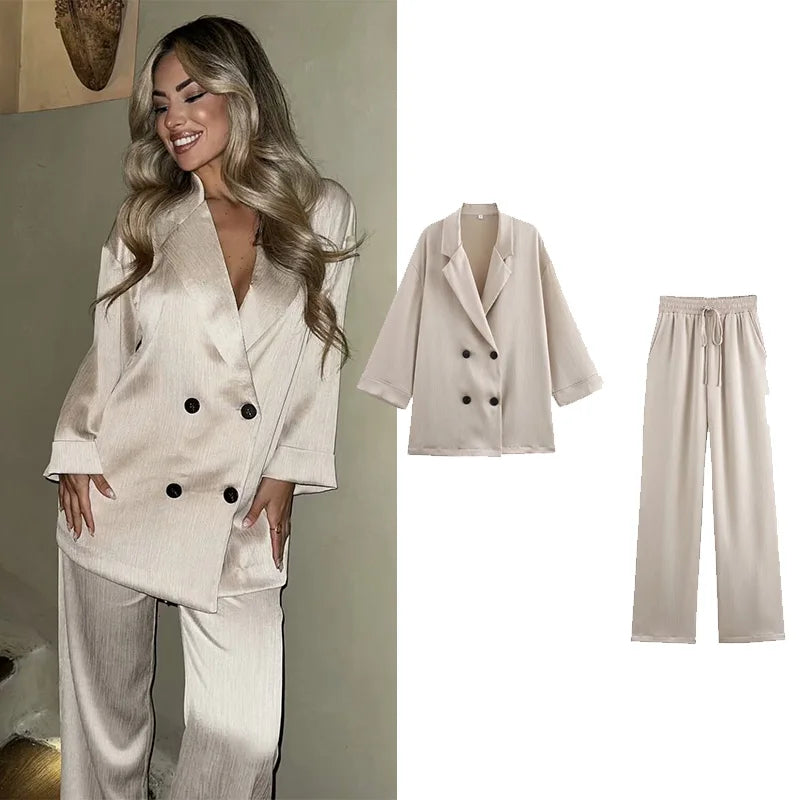 Stylish Pajama Style Women’s Two Piece Set with Double-Breasted Satin Blazer and Lace Up Creased-Effect Trousers for Spring Fashion.