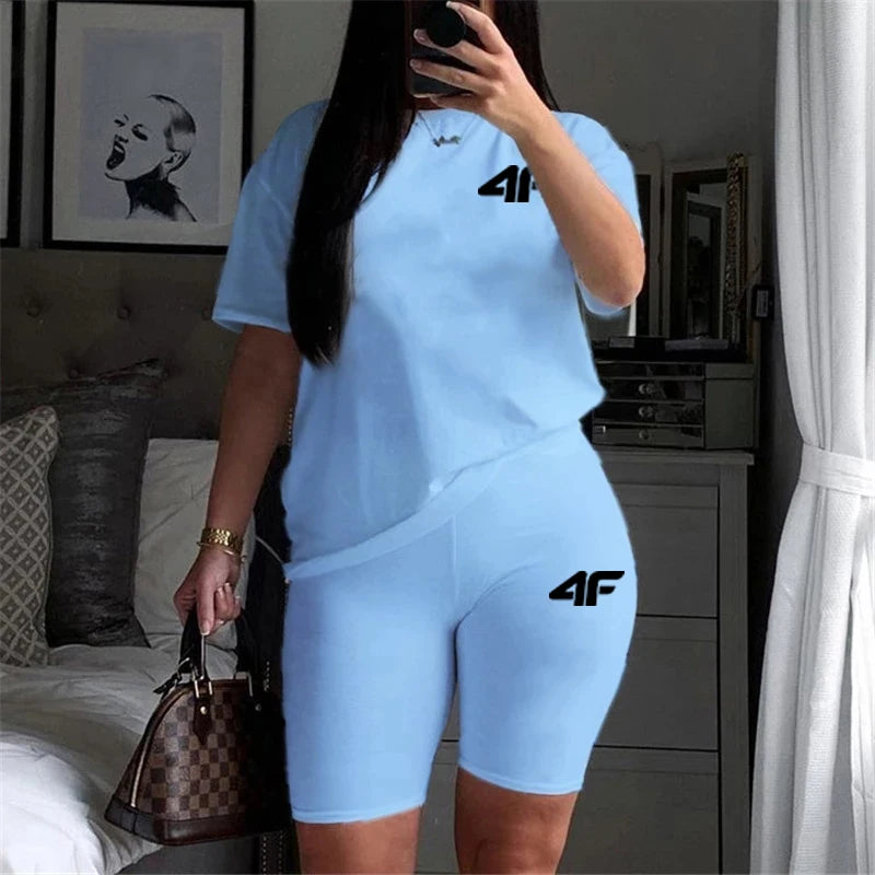 Womens Casual Two-Piece Tracksuit Set with Printed O-Neck T-Shirt and Comfortable Shorts for Gym and Jogging in light blue.