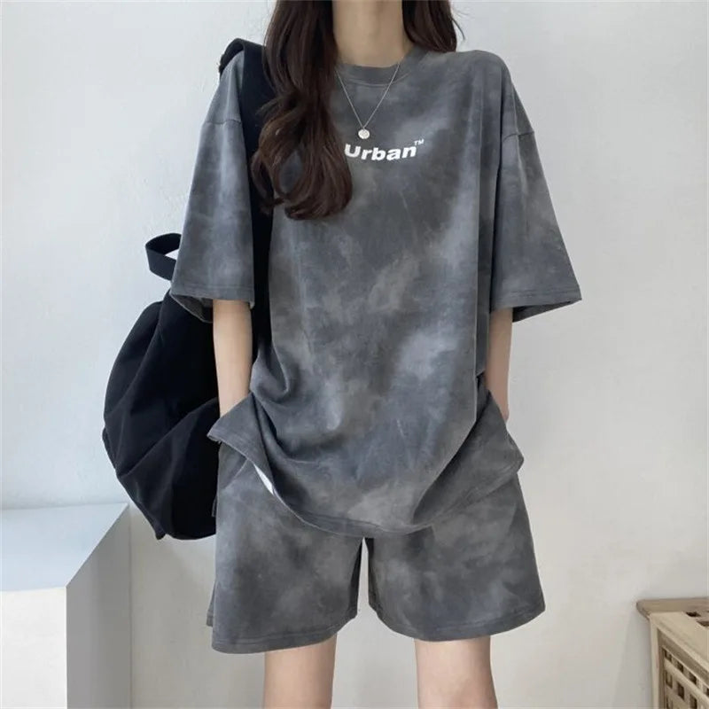 Casual loose fit 2Piece Women’s Tie Dye T-Shirt and Wide Leg Shorts Set with pockets, perfect for summer outings.