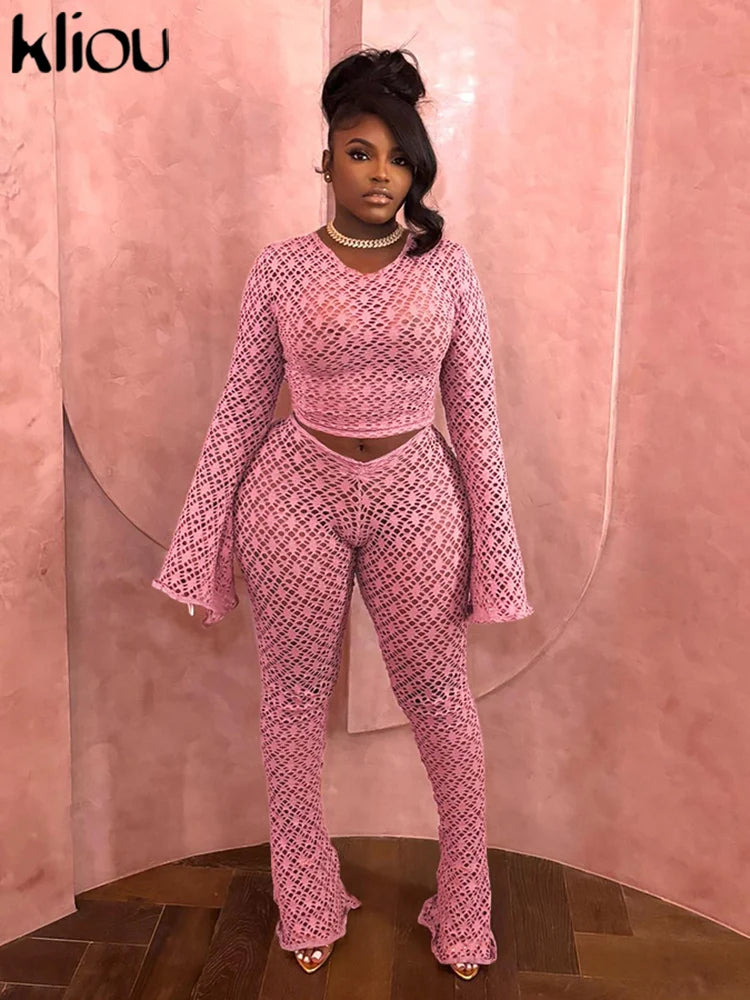 Stylish model wearing the Sexy Coquette 2 Piece Set Sheer Long Sleeve Slim Top and High Waist Flare Pants for nightlife.