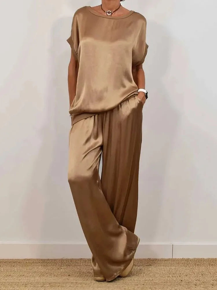 Elevate your style with the Smooth Satin Two Piece Set Women's Casual Outfit featuring O-neck top and wide leg pant.