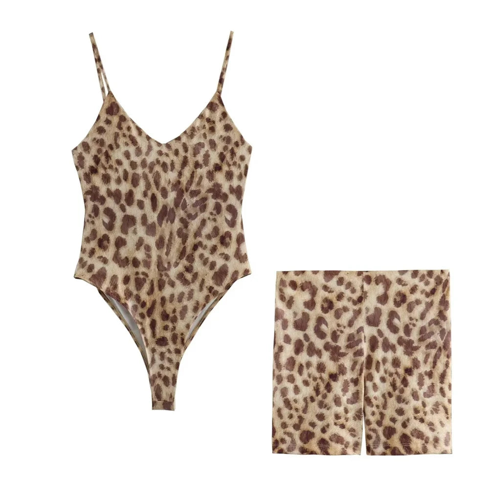 Elevate your summer style with the Women's Open Back One Piece Short Set with Leopard Print and Suspended Straps.