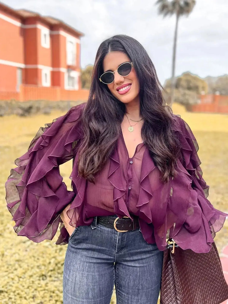 Chic and stylish, the Women’s Burgundy Ruffle Layer Casual Blouse Long Sleeve Loose Fit Button-Front Shirt by Zevity.