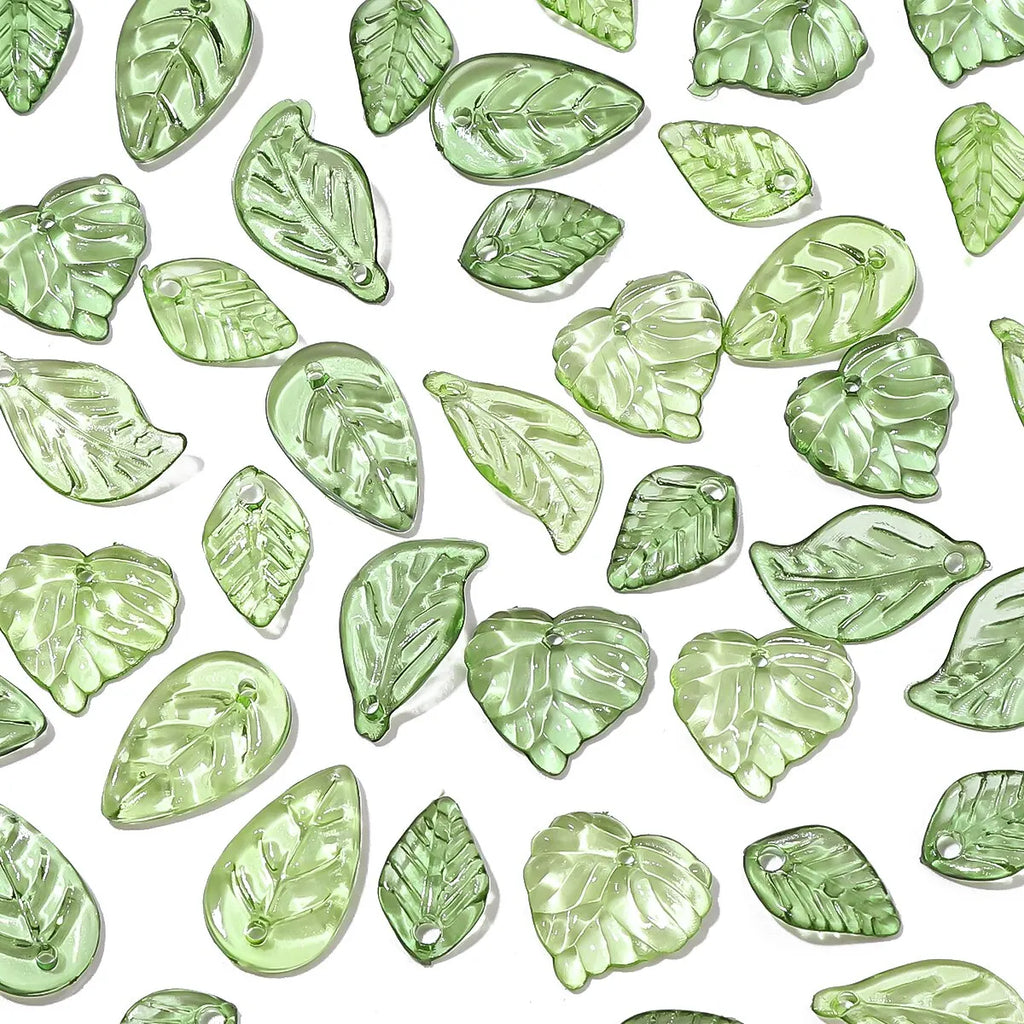 Enhance your jewelry designs with 100 Pieces Mini Acrylic Tree Leaf Beads for DIY Handmade Jewelry Necklaces and Earrings Accessories.