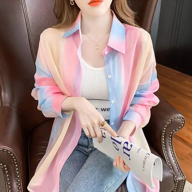 Stylish lightweight jacket featuring a sheer gradient rainbow design, perfect for casual outings. Women’s Long Sleeve Sheer Gradient Rainbow Casual Blouse Loose Fit Basic Shirt.