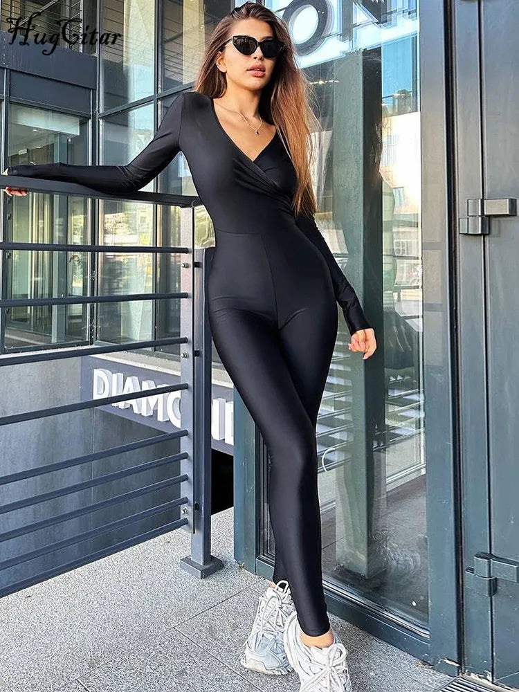 Hugcitar V Neck Long Sleeve Ruched Bodycon Skinny Jumpsuit, perfect for Y2K fashion and vacation wear, is a stylish party romper.