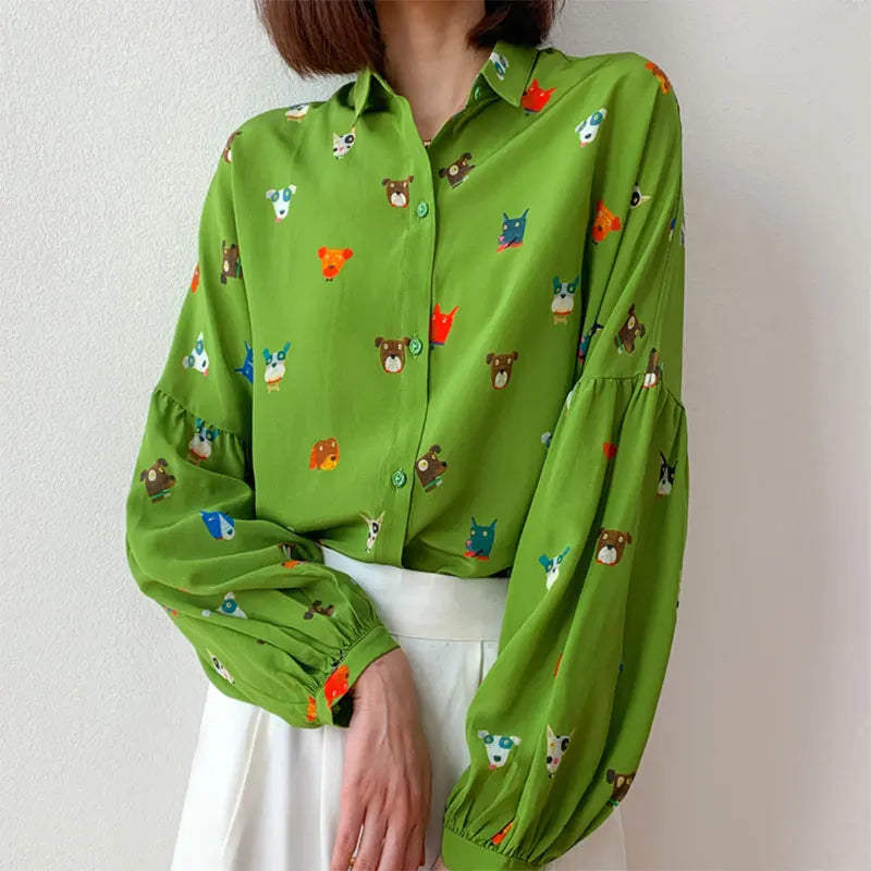 Stylish Women Shirt 100 Percent Mulberry Crepe Silk Green Lantern Sleeve Blouse with Cartoon Button Detail for casual wear.