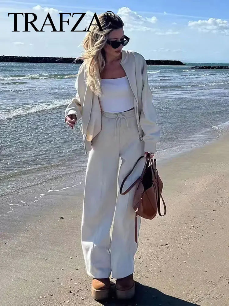 Stylish women's casual long sleeve bomber jacket and high waist loose drawstring trousers set by TRAFZA, perfect for outings.