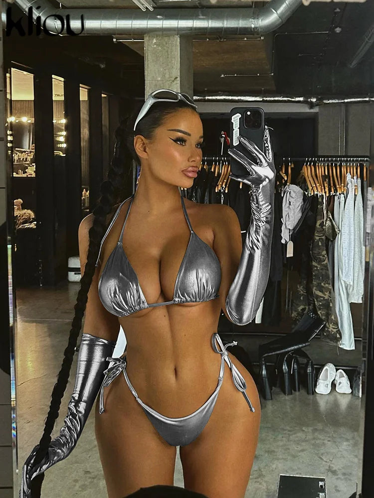 Stylish Kliou two piece women’s summer swimwear set with solid bandage halter bikini top and matching high waist shorts.