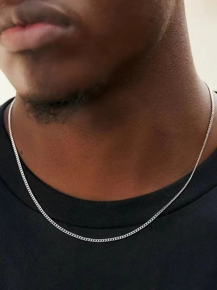 Men's Stainless Steel Cuban Chain Necklace Durable Titanium Steel Jewelry displayed on a model, showcasing its stylish design.