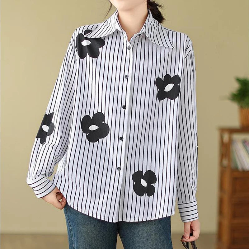 Elevate your style with this Women’s Turn-Down Collar Flower Stripe Long Sleeve Loose Fit Blouse Casual Single Breasted White Vintage-Inspired Shirt Top.