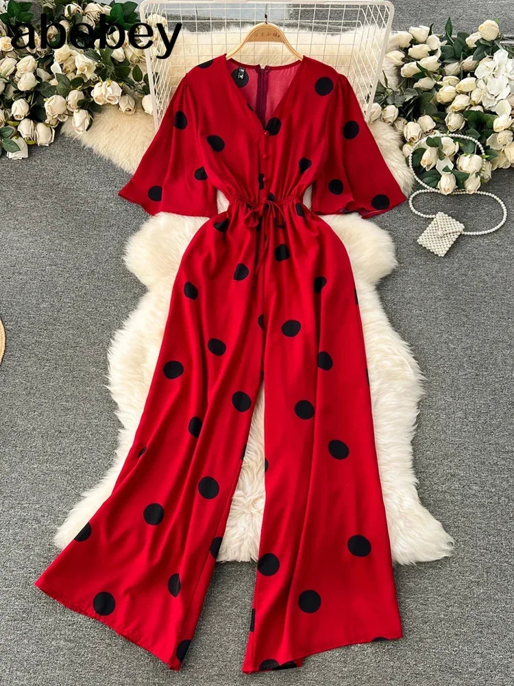 Stylish Women Wide Leg Polka Dot Jumpsuit with V Neck Dolman Sleeves and Slim Waist Design from abebey for a chic look.