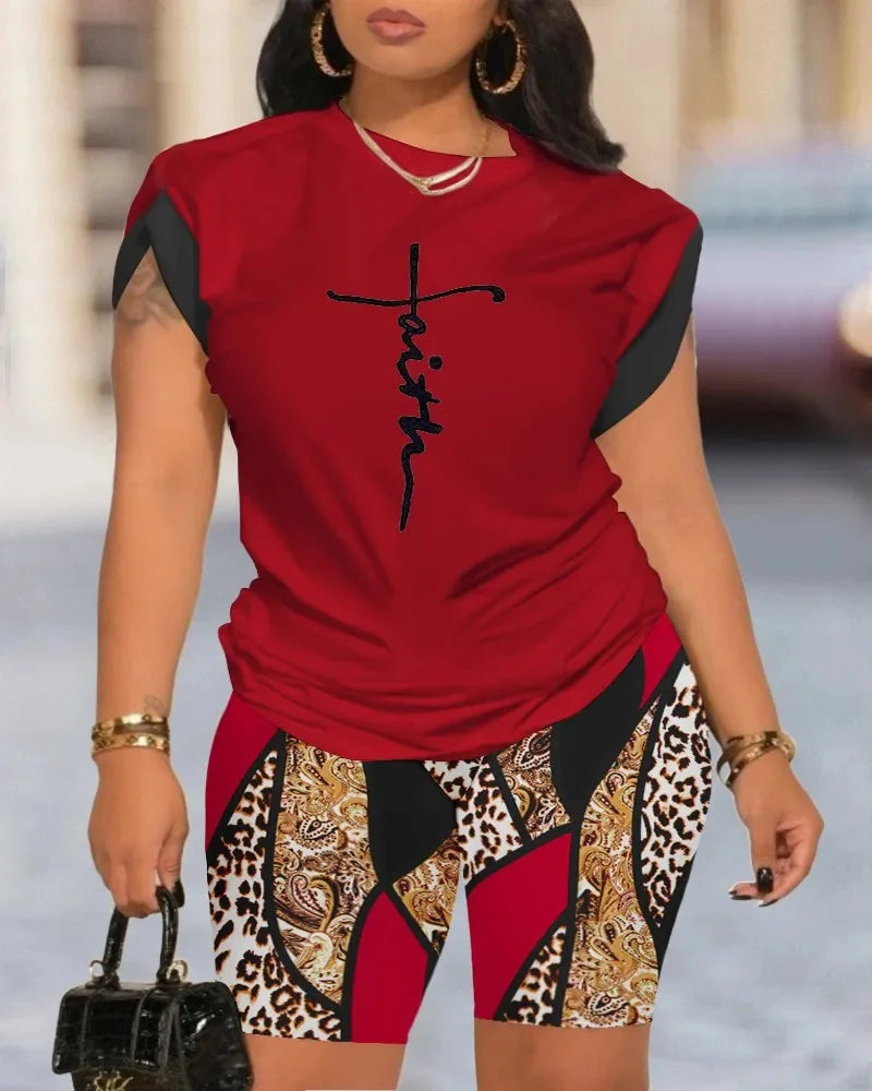 Elevate your style with the Women’s Summer Two Piece Set Printed Round Neck Short Sleeve Top with Casual Skinny Shorts Streetwear Ensemble.