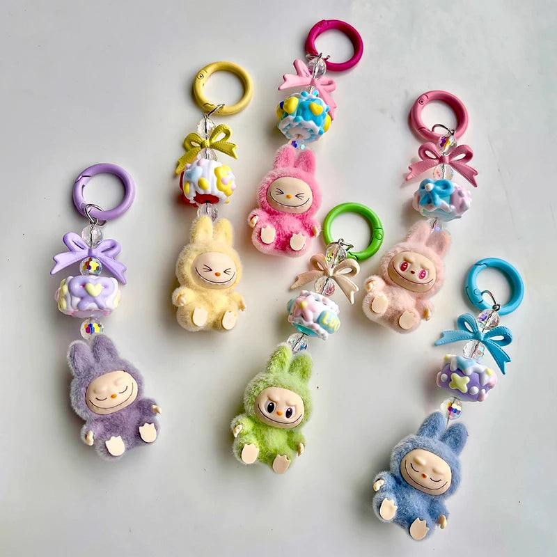 Charming Mini Keychain Cartoon 3D Doll Pendant for Students School Bags and Car Keys, perfect for adding fun and flair.