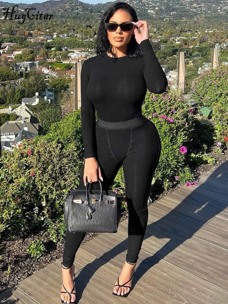 Stylish woman in a Long Sleeve Solid Crop Top and Pants Matching Set Two-Piece Casual Streetwear Sporty Tracksuit for Women by Hugcitar.