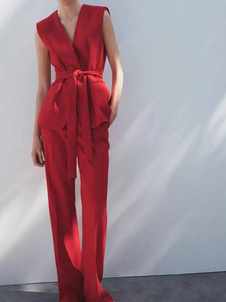 Stylishly showcasing the Fashionable Red Vest and Flared Pants Suit for Women with Belt, perfect for any occasion.