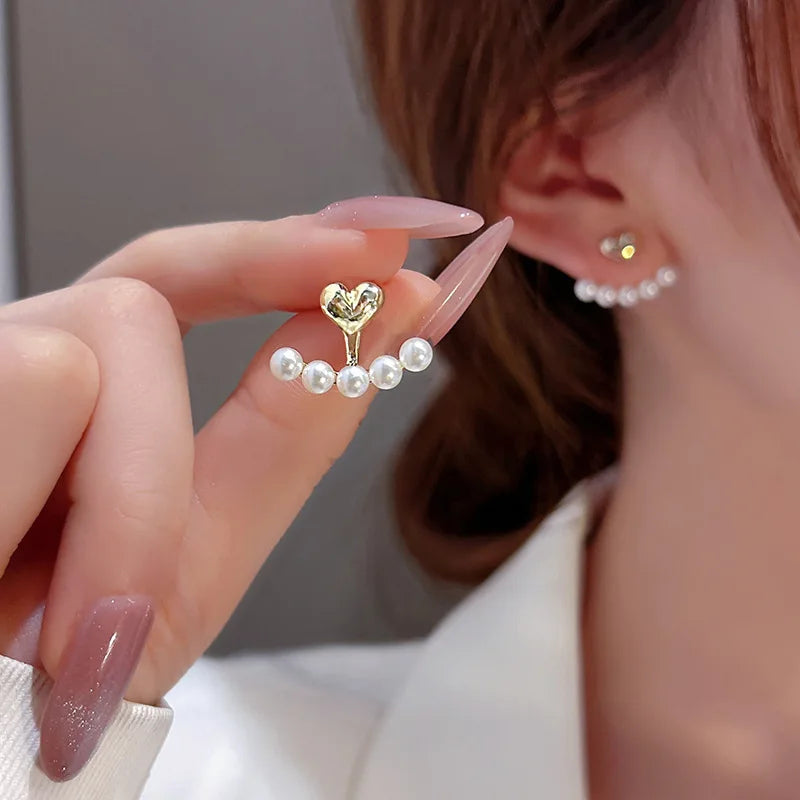 Light Luxury Imitation Pearl Heart Shaped Stud Earrings for Women, perfect for weddings and parties, adding elegant charm.