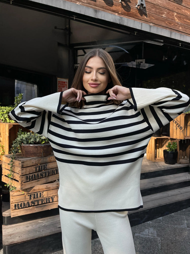 Stylish model showcases the Winter Oversized Stripe Knitted Turtleneck Sweater Set with Casual Long Sleeve Pullover and Elastic Waist Pants.