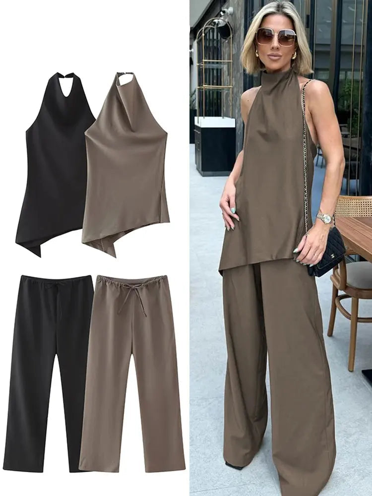 Effortlessly chic, the Women Vintage Solid Two-Piece Set features a sexy backless halter top and drawstring trousers.