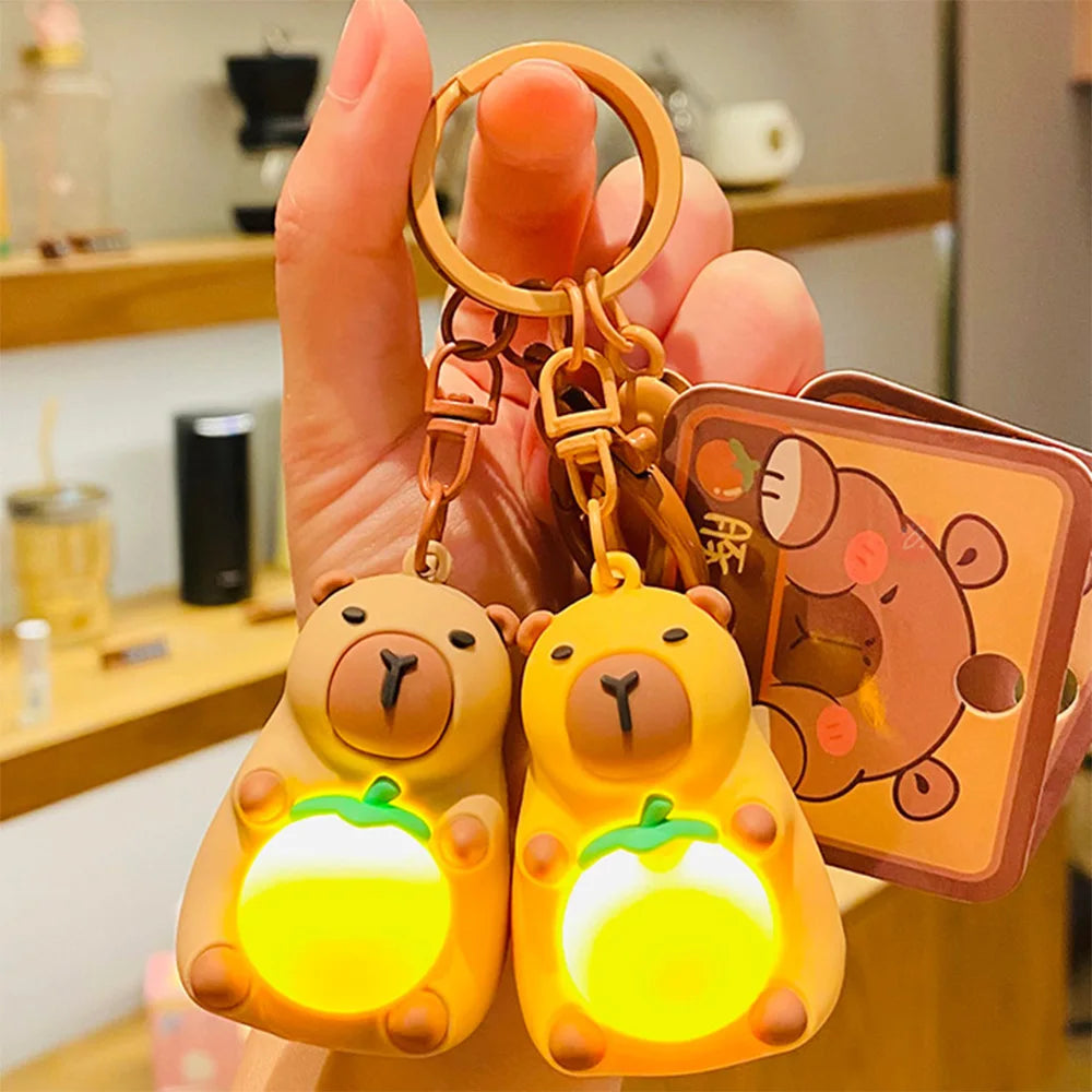 Kawaii Capybara Luminous Keychain Mini Doll Warm Light Toy adds charm and warmth to your everyday accessories.