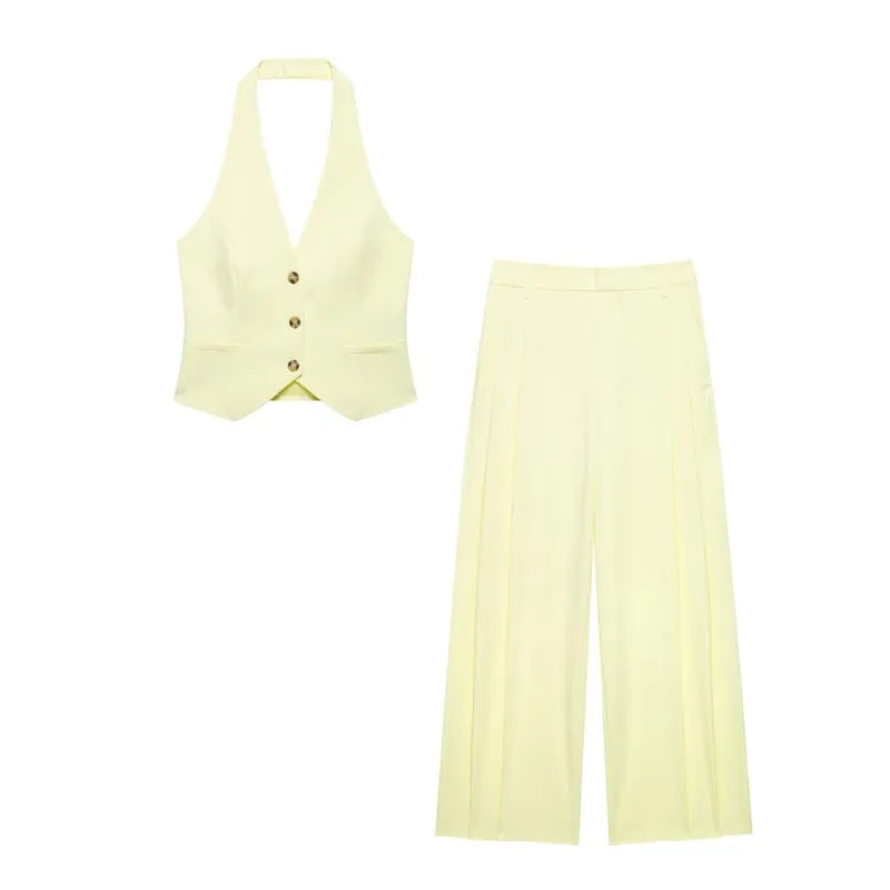 Stylish High Waist Two Piece Set for Women with Fitted Halter Neck Waistcoat and Double Pleat Trousers in soft yellow.