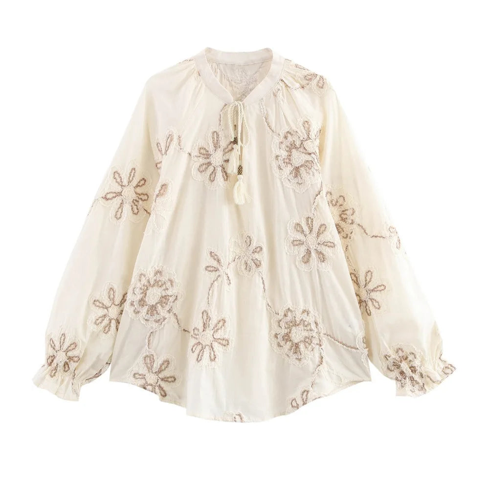 Elevate your style with the ZBZA Womens Flower Embroidered Cropped Blouse Loose Tassel Lantern Sleeve Round Neck Chic Top.