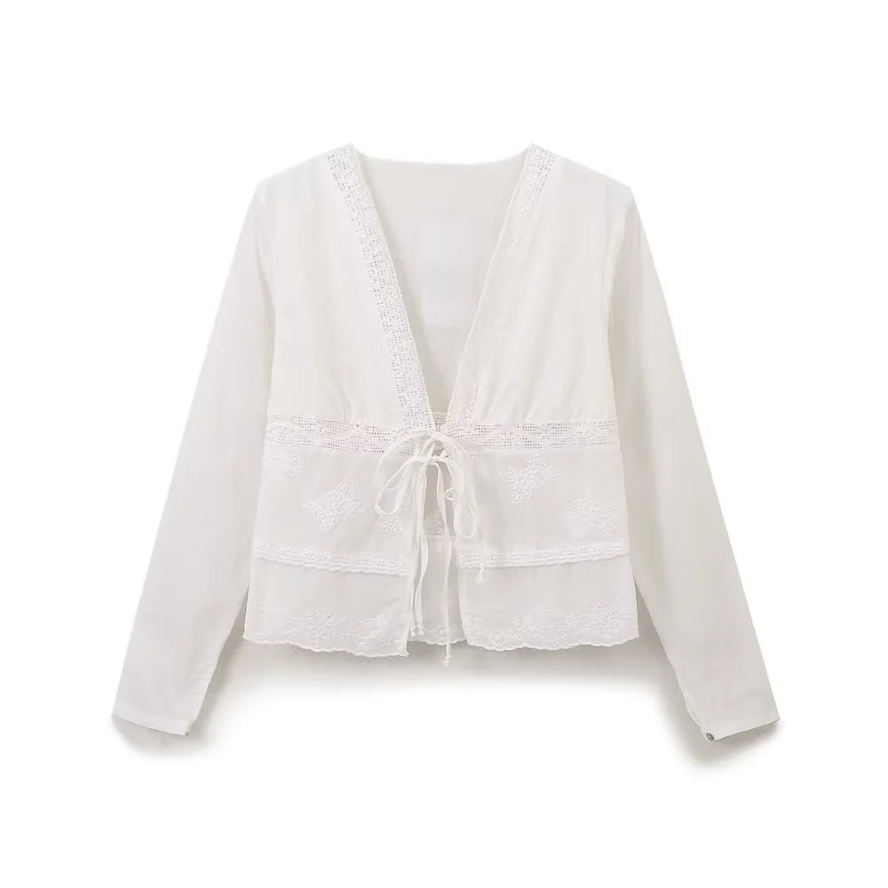 Stylish white embroidered shirt featuring an elegant French bow, perfect for casual and business wear.
