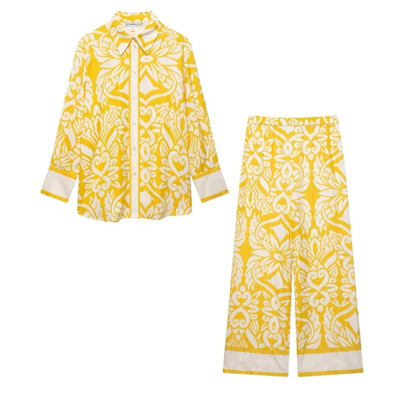 Elevate your style with this Women Yellow Printed Office Suit Set Single Breasted Long Sleeve Shirt High Waist Wide Leg Trousers Elegant Workwear Ensemble.