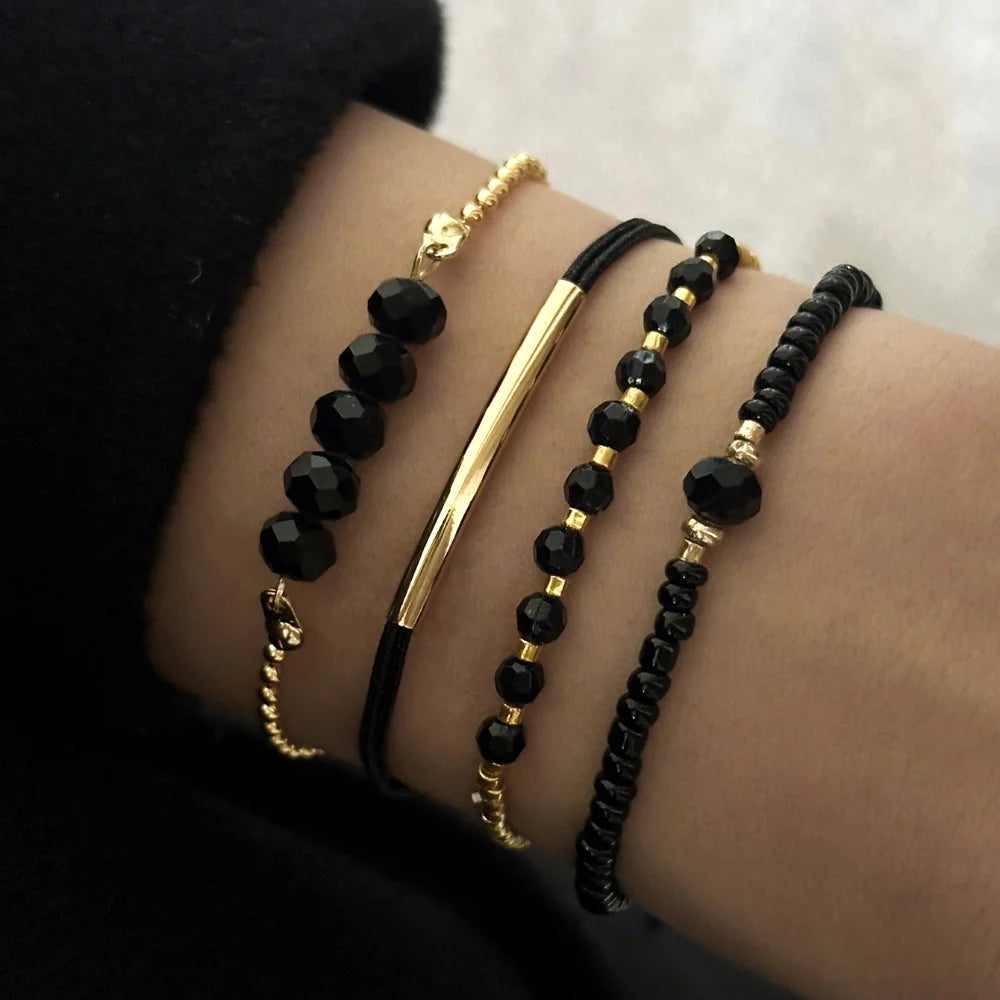 Trendy 4Pcs Set Black Glass Stone Bracelets for Women, a chic handmade jewelry accessory perfect for any occasion.