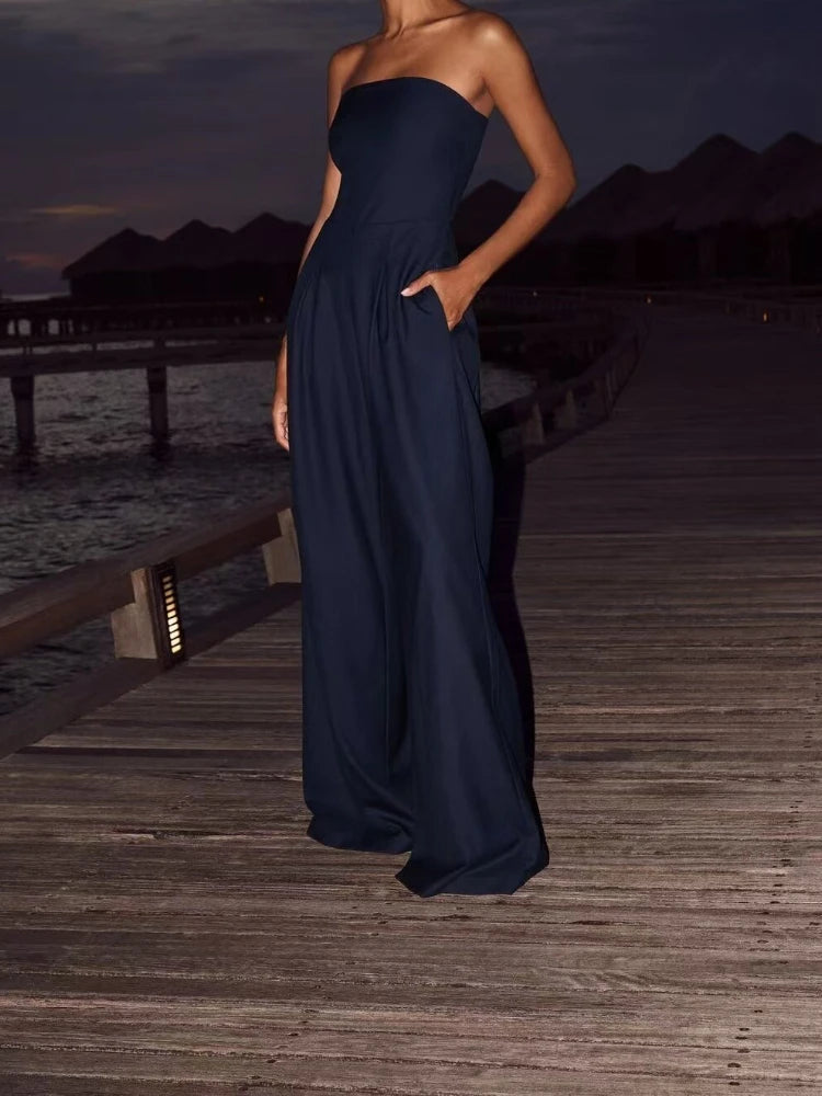 Stylish model showcasing the Women's Casual Backless Slim Fit Smocked Waist Temperament Jumpsuit for Elegant Daywear.