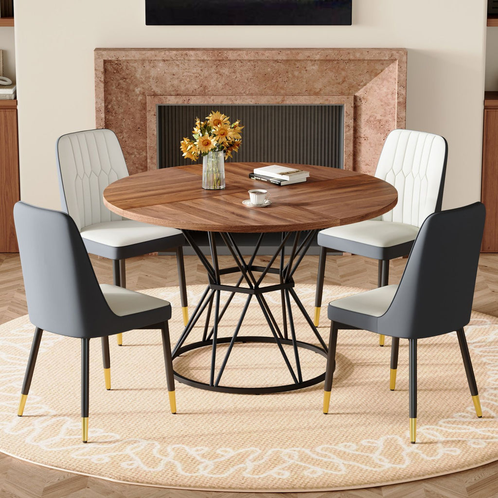 Table and chair set.A circular walnut MDF dining table with a diameter of 47.3 inches,black hourglass shaped metal brackets.Paired with 4 White and Dark Gray spliced color PU chairs.