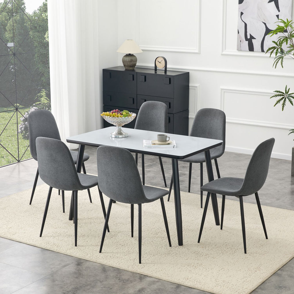 Table and Chair Set.Modern dining table. White imitation marble texture glass top + lower black MDF board,black metal legs.Paired with 6 Dark Gray Linen-Cotton Material Dining Chair with Metal Leg.