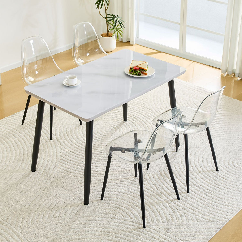 Table and Chair Set.Modern rectangular dining table.White Tempered glass countertop+lower MDF board.Paired with 4 Transparent Plastic Chairs with Black Metal Legs.Bring a comfortable home experience.