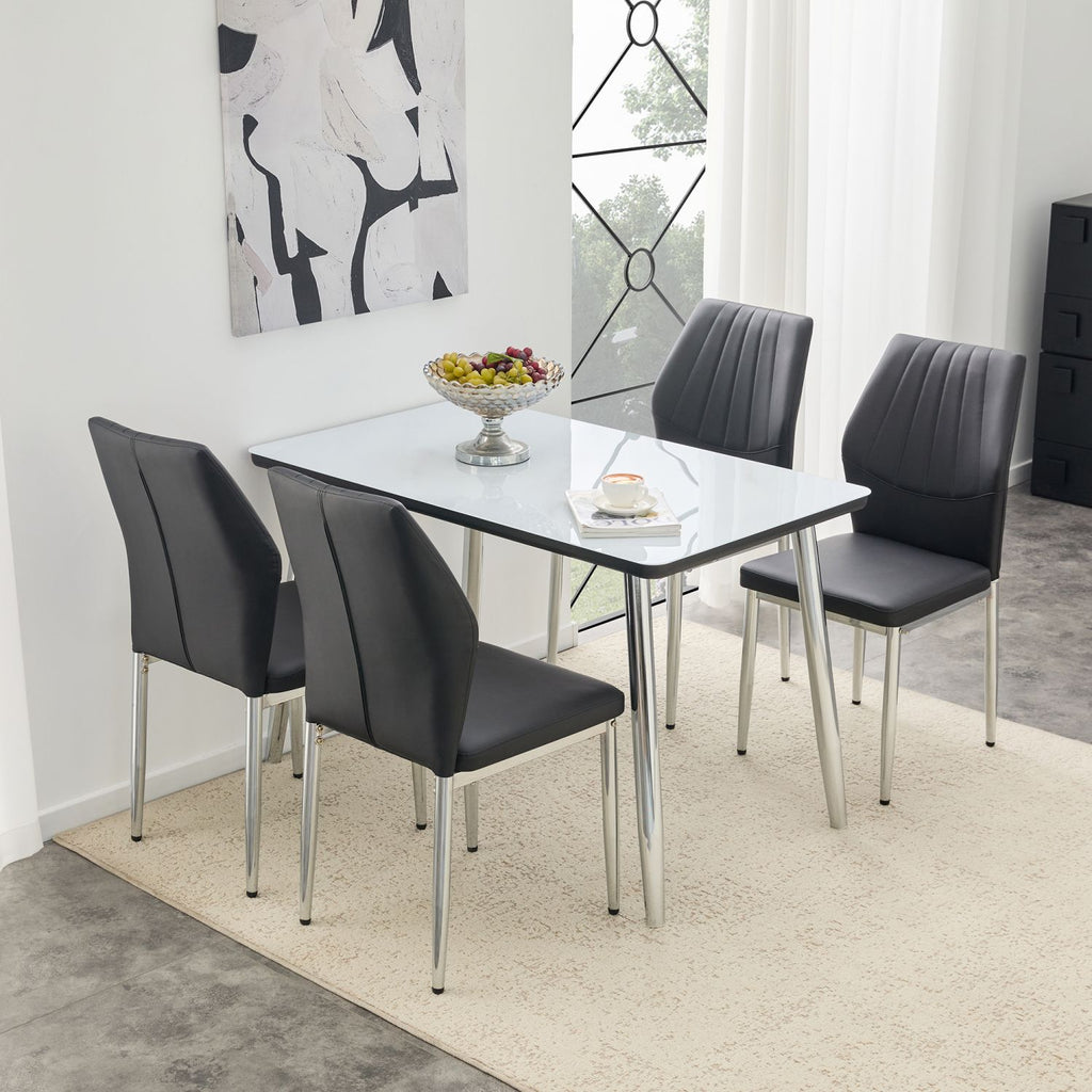 Table and chair set.White imitation marble texture glass top + lower black MDF board, silver metal tapered legs.Paired with 4 Black PU Chairs with silver legs. 37 inches High: Ergonomic PU Backrest.