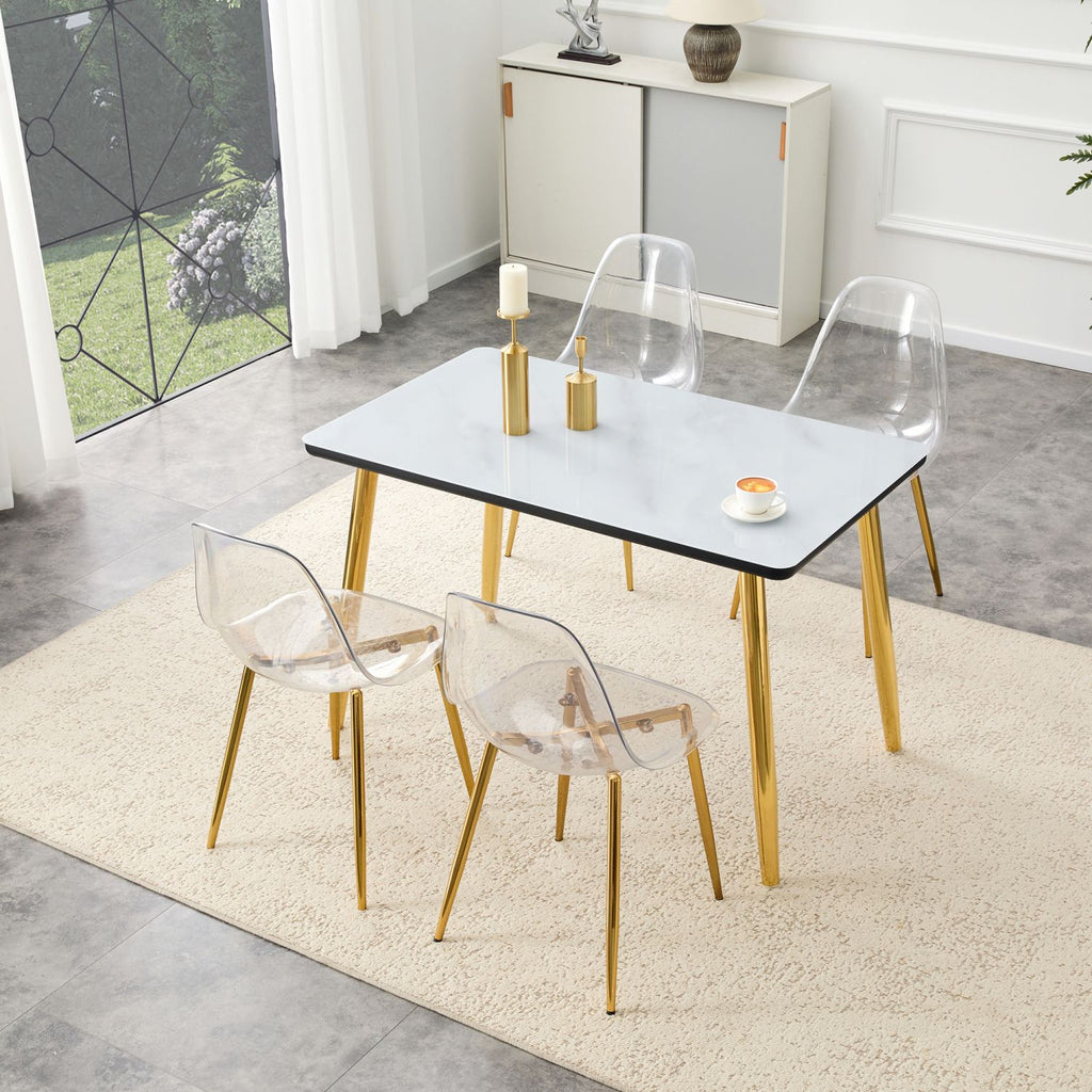 Table and chair set.White imitation marble texture glass top + lower black MDF board,golden metal tapered legs.Paired with 4 Transparent Plastic Chairs with Golden Metal Legs.