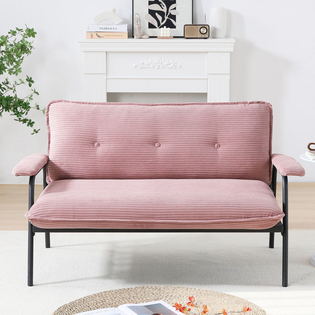 The 53-inch pink sofa offers a spacious layout in the small apartment, easily handling various scenarios from watching movies to working